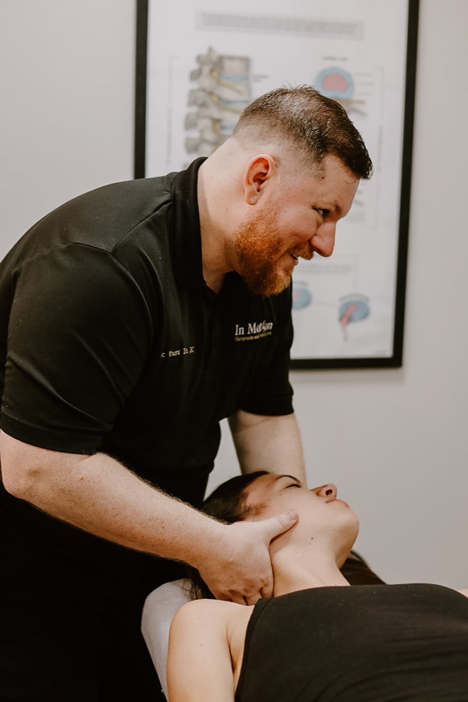 Dr. Torina delivering a gentle cervical adjustment at In Motion in Oviedo, FL